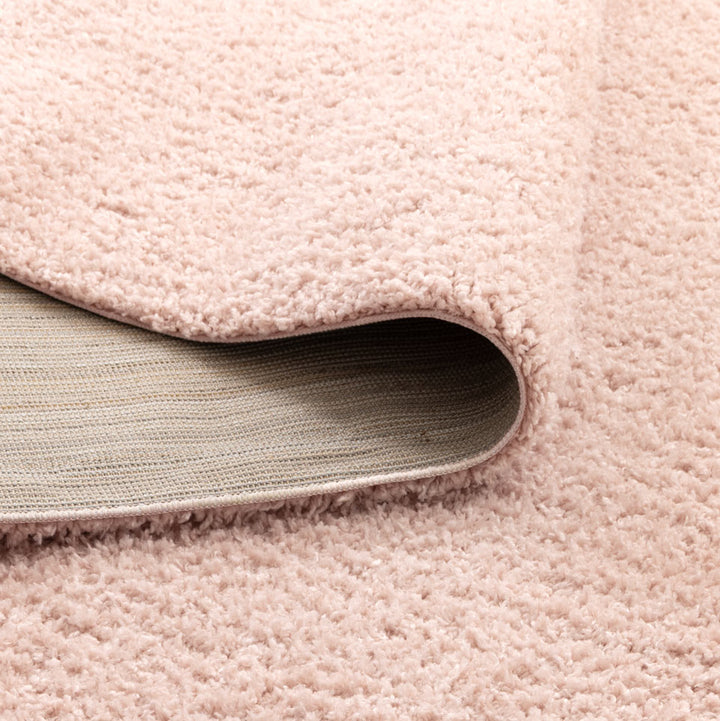 Lune Blush Pink Shaggy Rug corner detail showing 40mm pile depth and rug backing