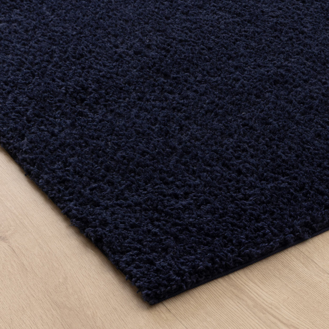 Close-up of Lune Navy Shaggy Rug pile 40mm ultra-soft non-shedding polyester