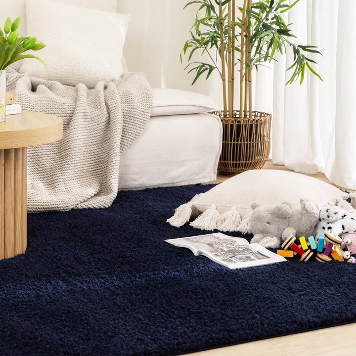 Lune Navy Shaggy Rug flat lay — top-down view showing full rug size and deep navy tone