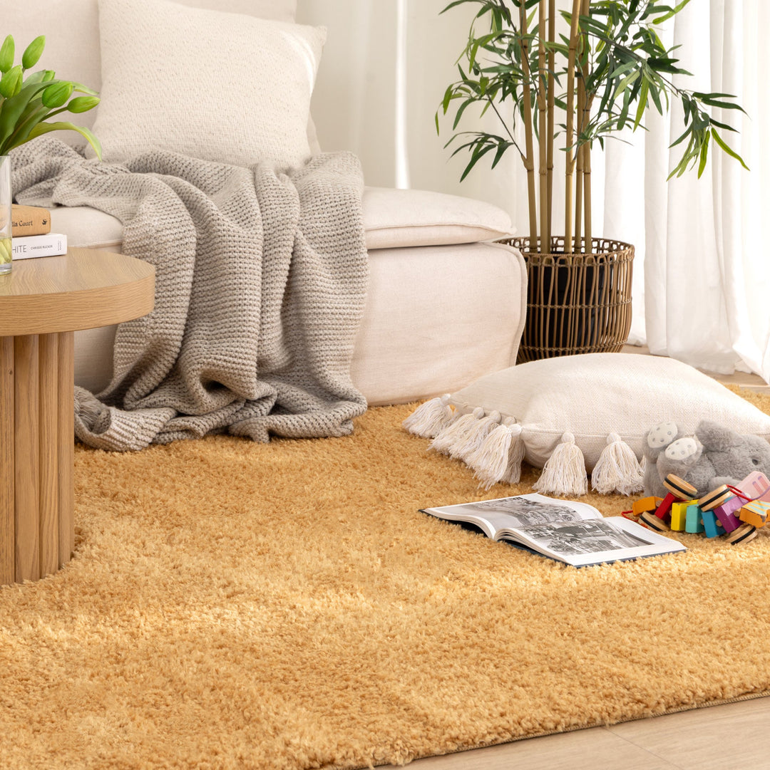 Lune Ochre Shaggy Rug styled in a warm boho Australian living room with kids toy on the rug