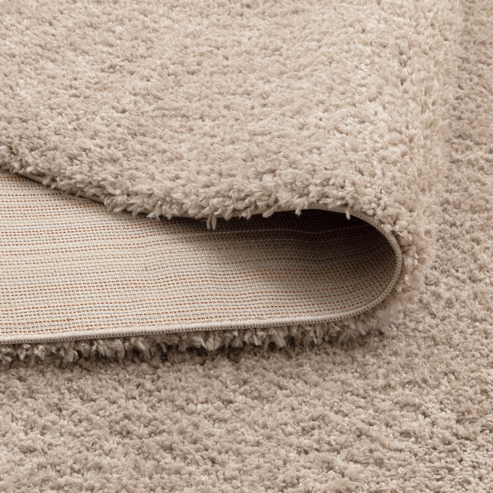Lune Taupe Shaggy Rug corner detail showing 40mm pile depth and rug backing