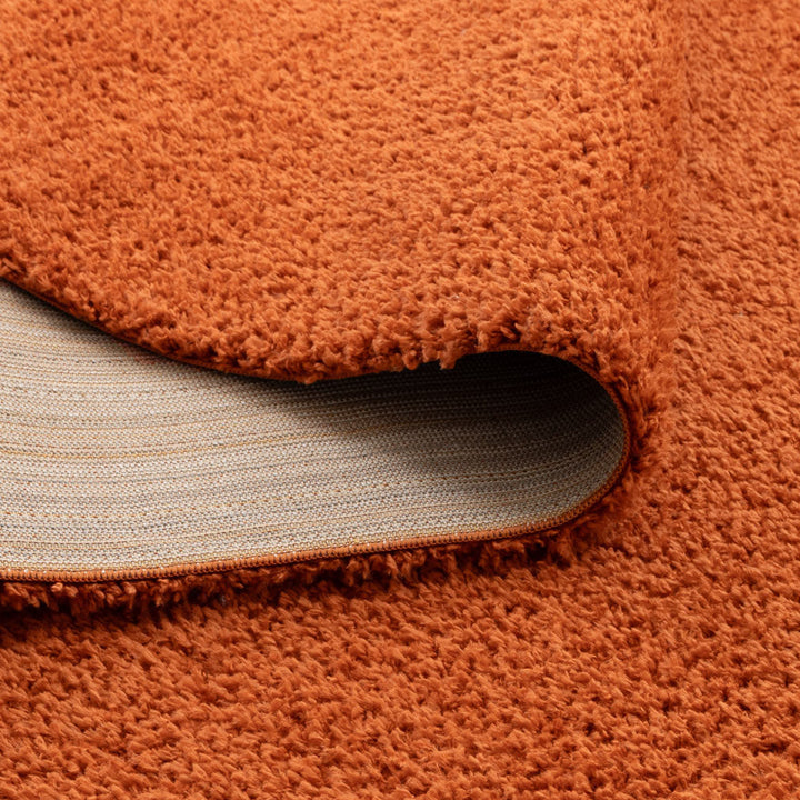 Lune Terracotta Shaggy Rug corner and backing detail