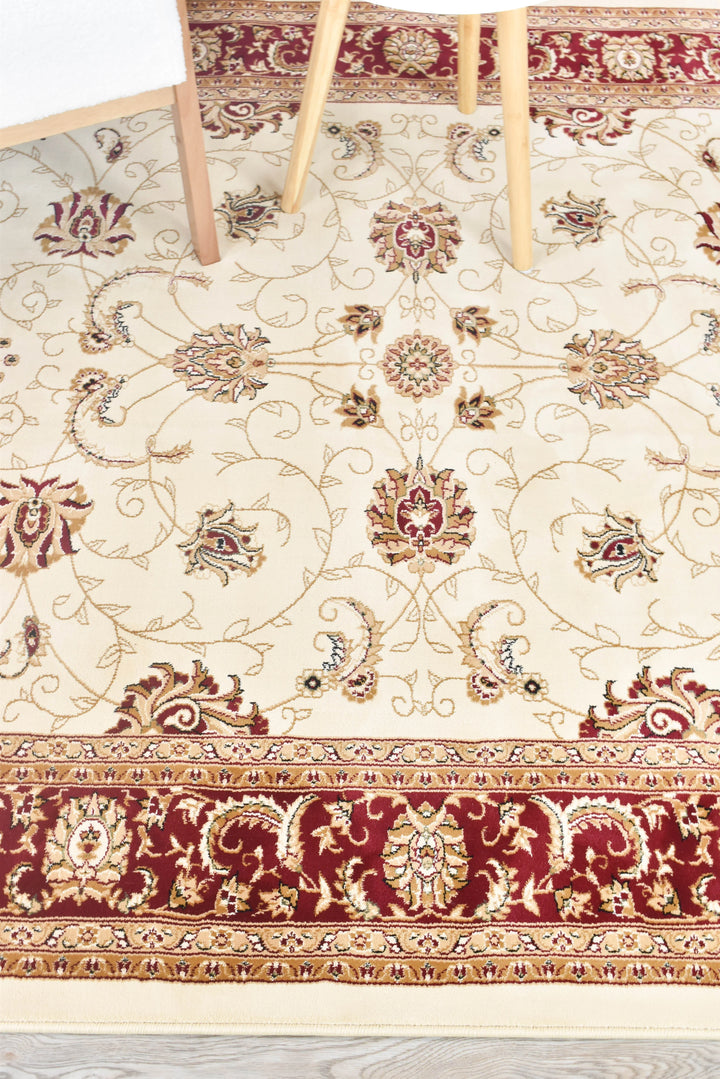 Traditional cream rug red border