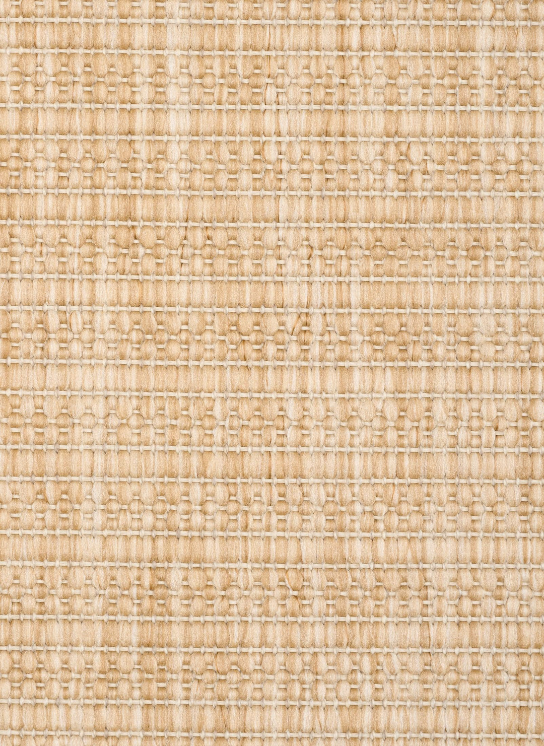 Close-up of a beige woven rug highlighting its diamond lattice pattern and chunky looped fibers.