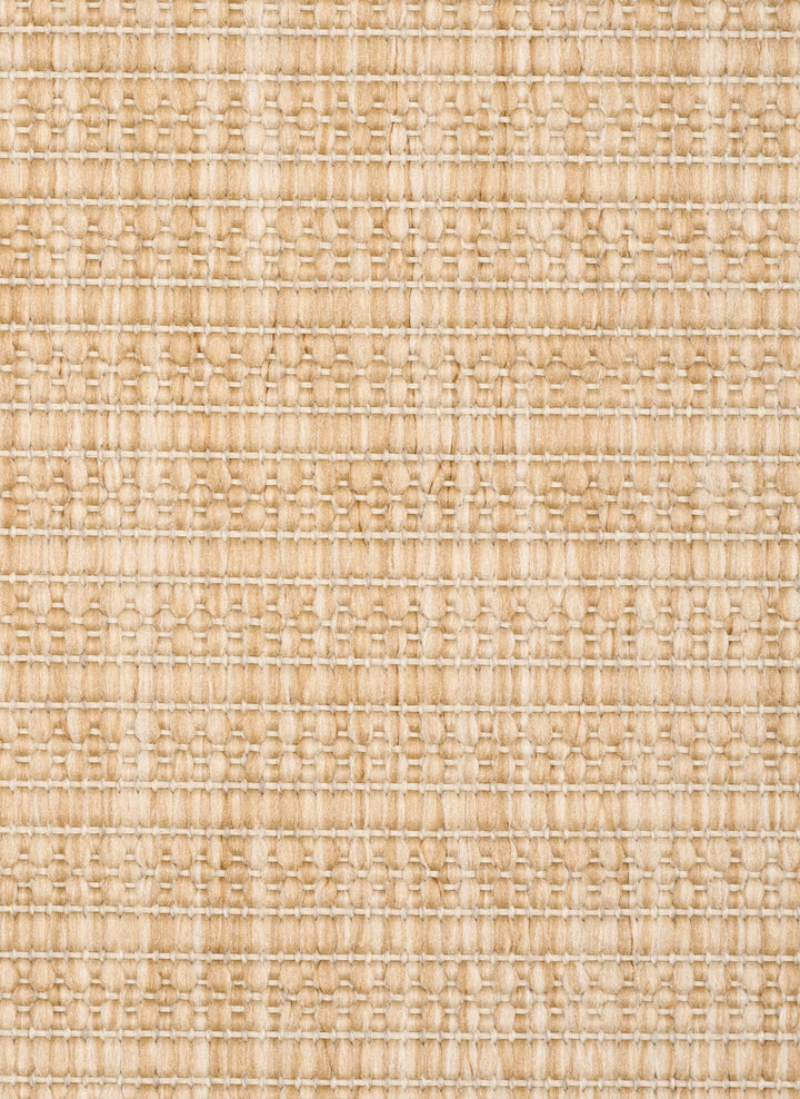 Close-up of a beige woven rug highlighting its diamond lattice pattern and chunky looped fibers.
