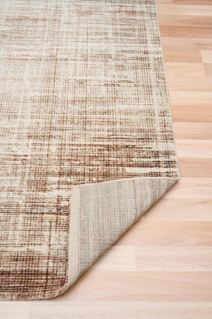 Rug corner flipped to reveal the woven underside.