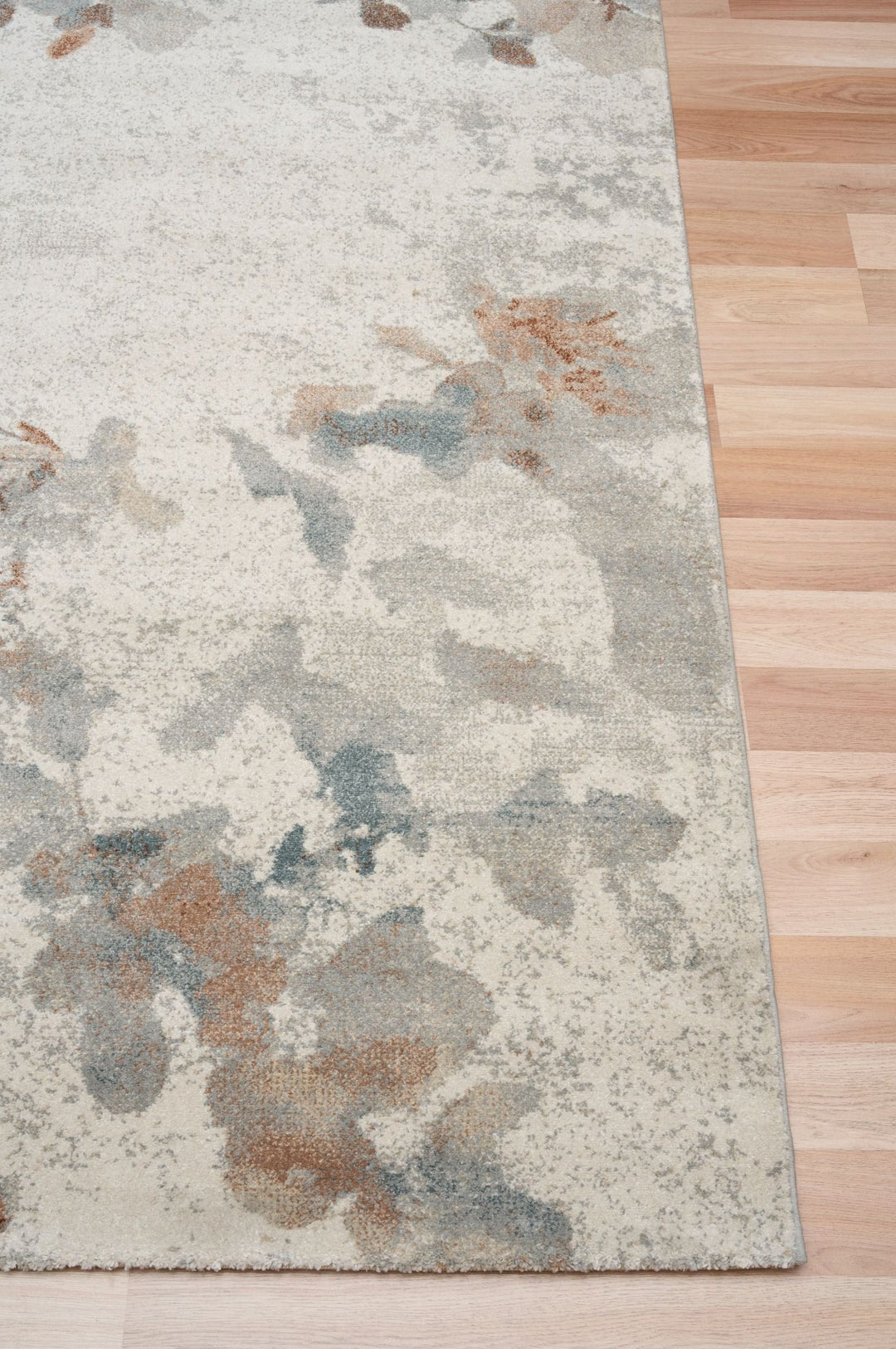 Close-up of rug corner showing detailed floral design.