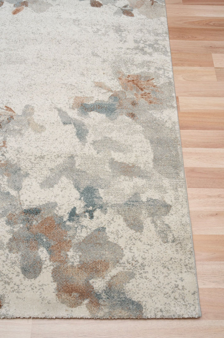 Close-up of rug corner showing detailed floral design.