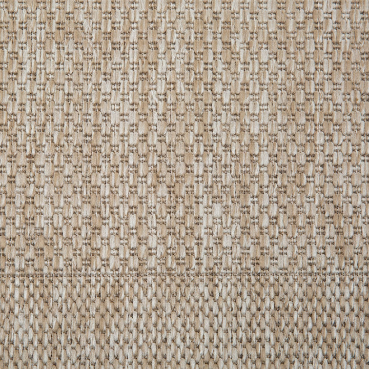 Close-up of sand rug woven surface.