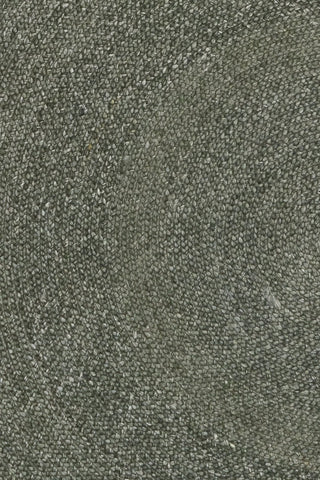 Close up of green round wool rug