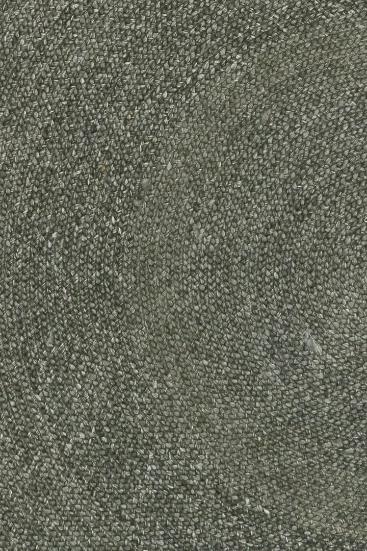Close up of green round wool rug