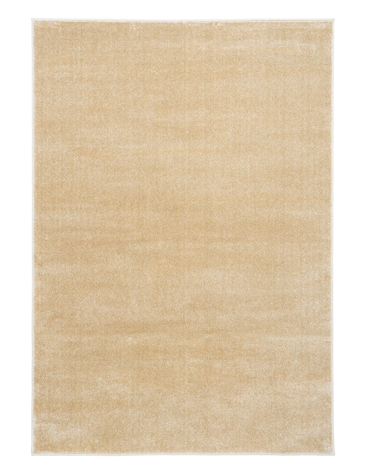 Beige rug full view with soft velvet-like texture.