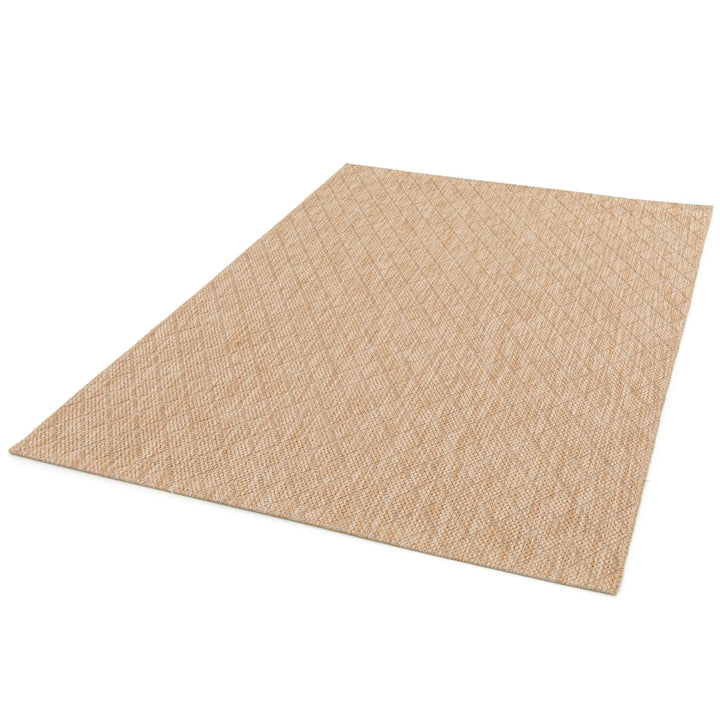 Beige woven rug with subtle diamond lattice pattern, three-quarter view on a white background.