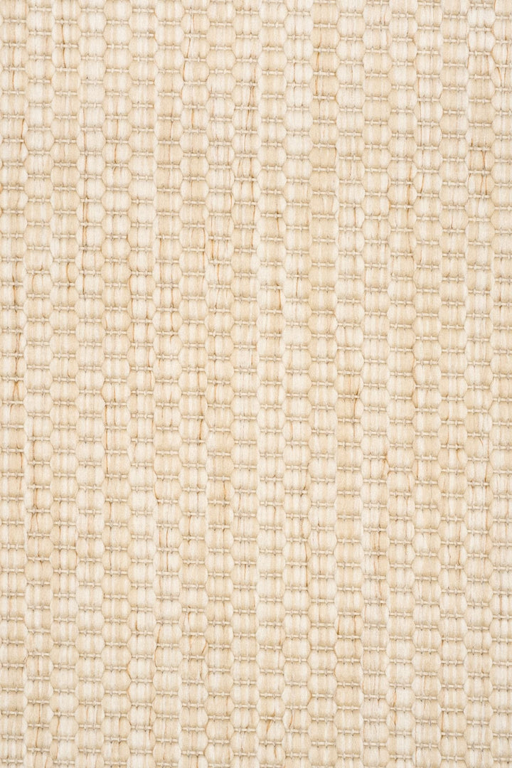 Close-up swatch of a light beige/ivory woven rug, showing thick basket-weave loops arranged in vertical ribs with subtle color variation.