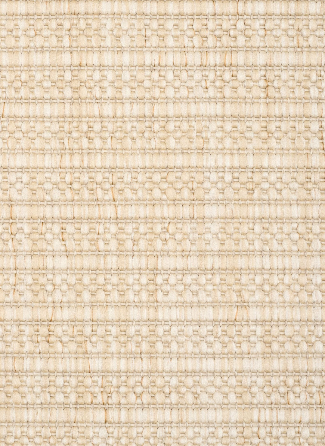 Close-up of a beige woven rug highlighting its diamond lattice pattern and chunky looped fibers.
