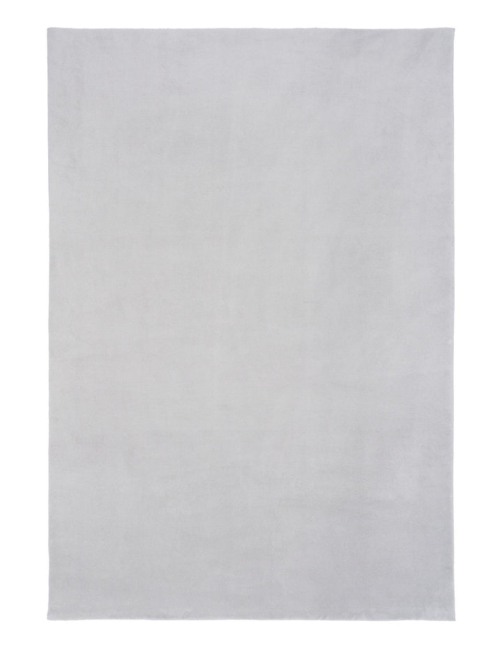 A plain rectangular light grey rug photographed from above