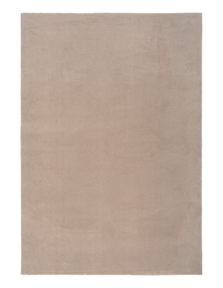 A plain rectangular clay-colored rug photographed from above.