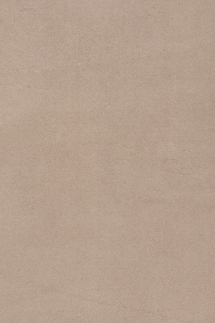Close-up fabric swatch of a clay rug showing its textured surface.