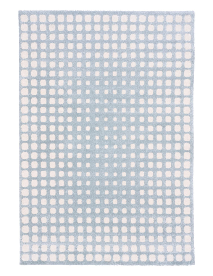 Full view of blue rug with white square design.