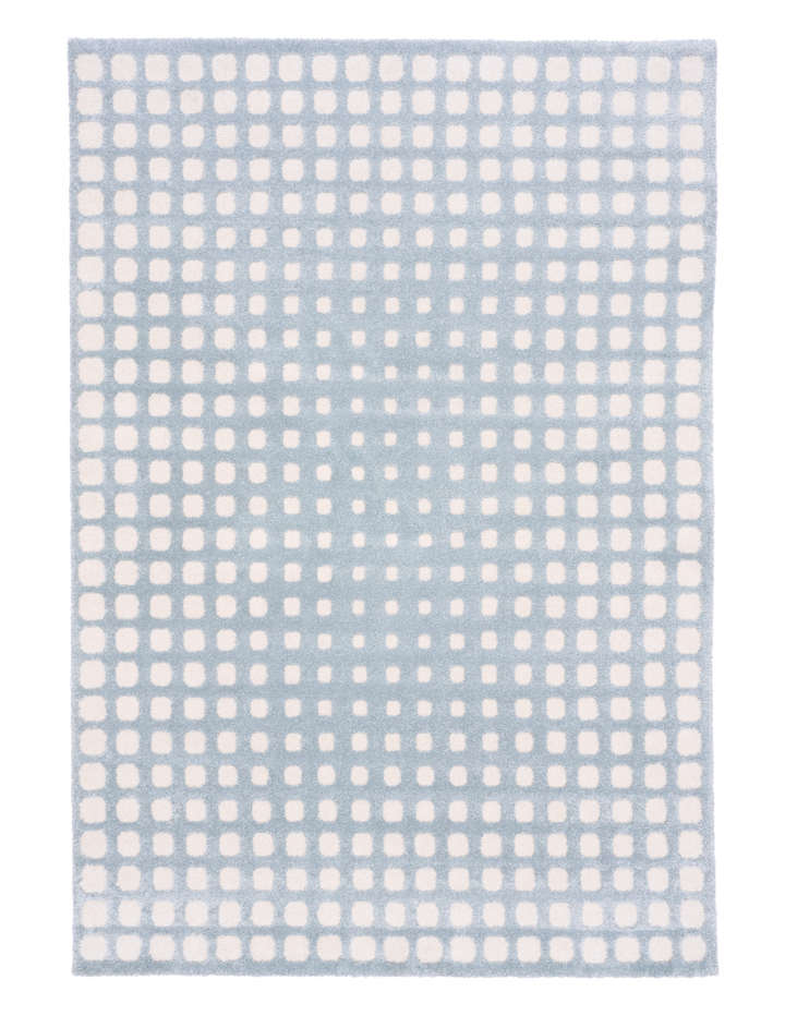 Full view of a blue rug with white square designs.