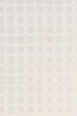 A close-up of the textured white rug pattern.