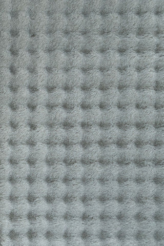 Full rectangular light grey textured fluffy rug on plain background.