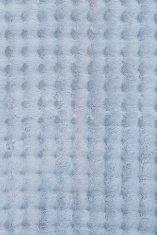 Light blue textured fluffy rug with soft raised pattern