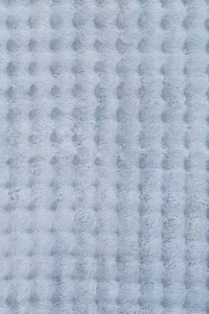 Light blue textured fluffy rug with soft raised pattern