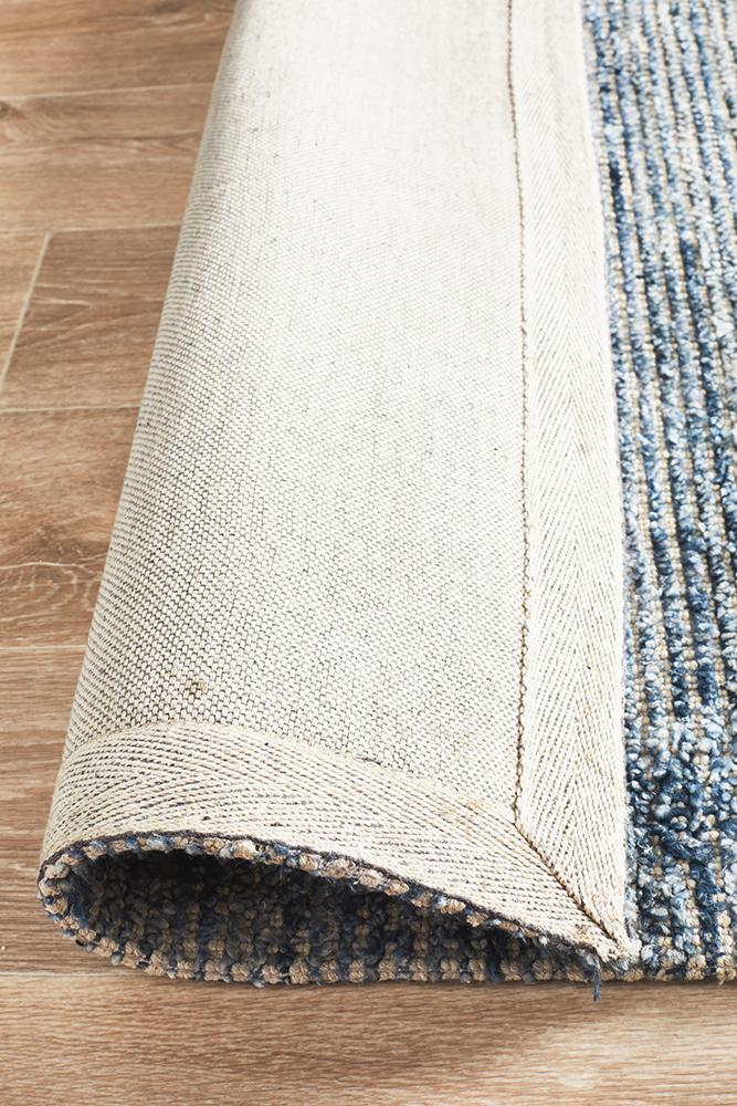 Allure Indigo area rug showing the all natural cotton backing, soft and safe for all wooden surfaces. Deco Rugs, mill park