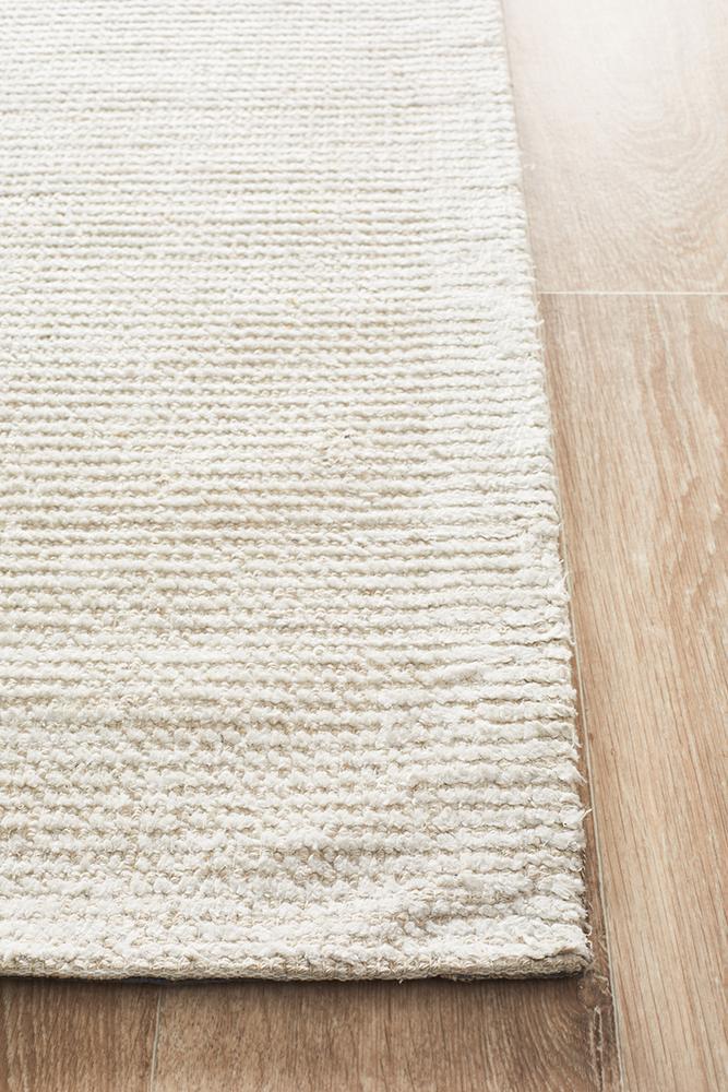 Allure Ivory cotton rayon rug on hardwood floor showing natural fiber texture. Mill Park Rug Store