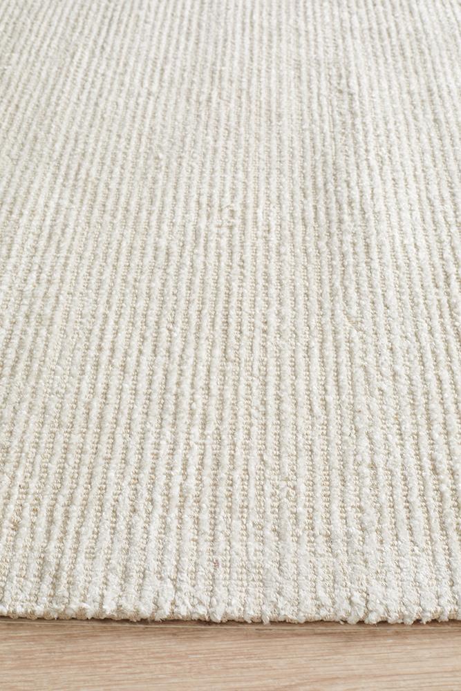 Close up of Allure Ivory rug in minimalist space with clean ivory and neutral tones