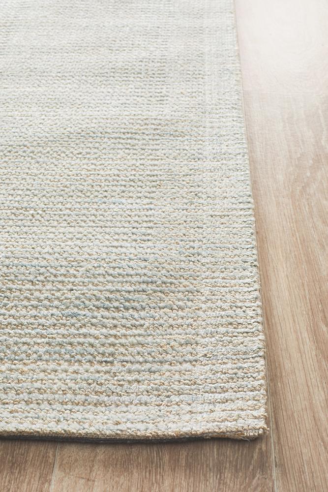 Full view of Allure Sky cotton rayon rug displaying peaceful sky blue colorway and loop texture